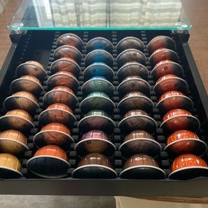 Nespresso glass top drawer organizer with 38 various Nespresso Pods.